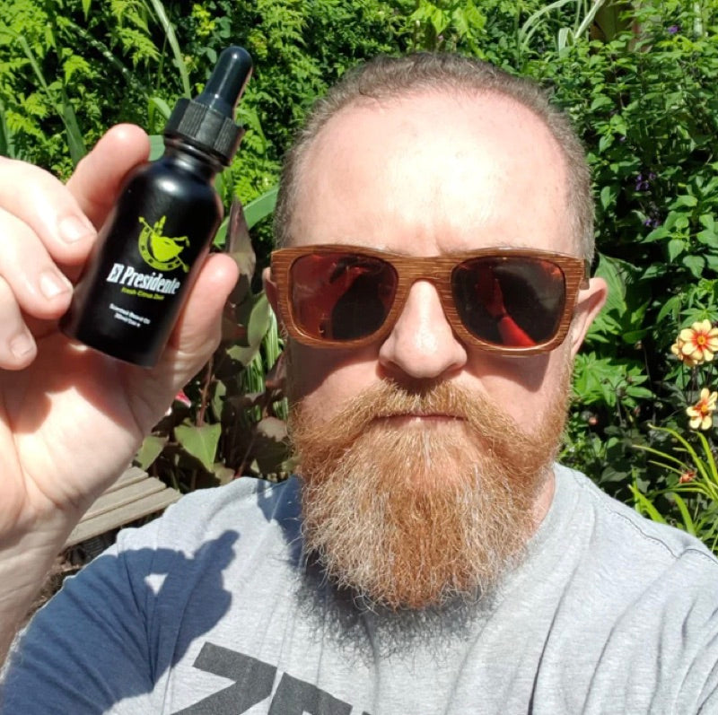 Customer holding El Presidente beard oil